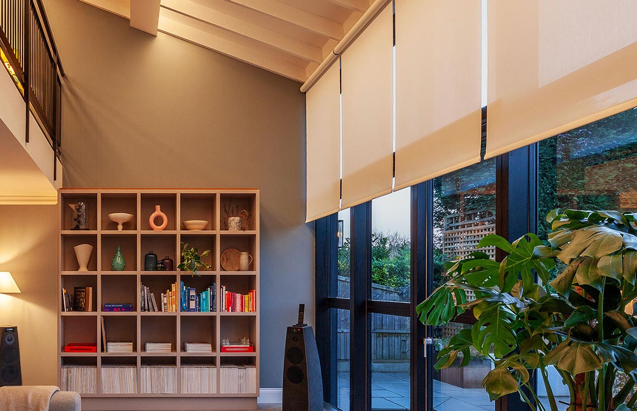 Palladiom wire-free blinds on a double-height window wall in a living space